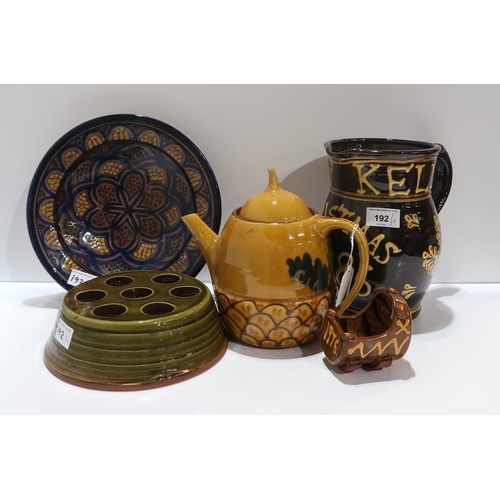 192 - A slipware jug titled Christmas 1986, a model of a child's cot dated 1976, other slipware and studio... 