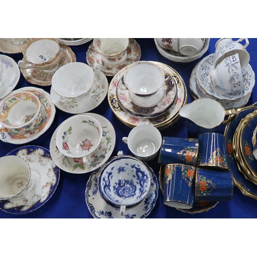 247 - A Collingwood China teaset with blue ground and orange decoration, together with assorted other cups... 