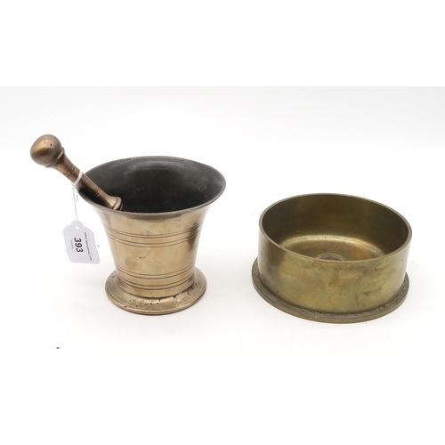 393 - A heavy brass mortar and pestle, 18th/19th century, together with a large 