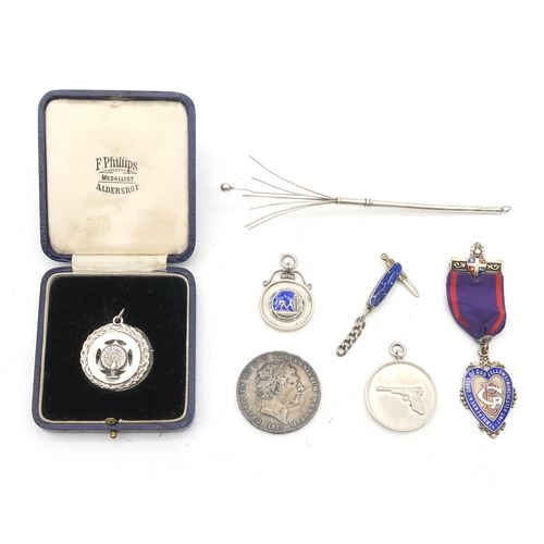 394 - An Independent Order of Oddfellows Manchester Unity enamelled silver medal, another cast with a pist... 