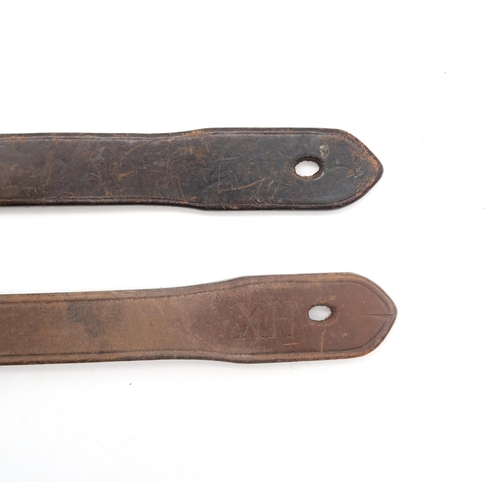 461 - Two leather tawses by John J. Dick of Lochgelly, one being the 