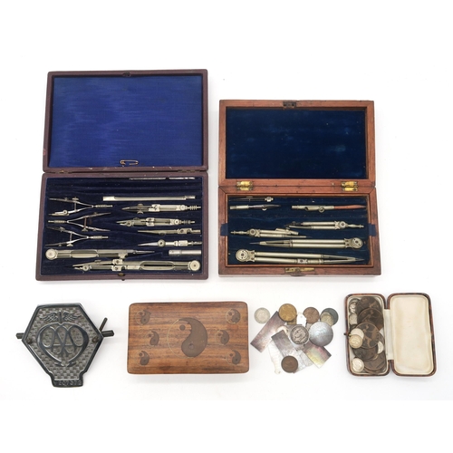 462 - Two cased sets of draughtsman's instruments, two large drawing squares, a chrome AA grille badge, mi... 