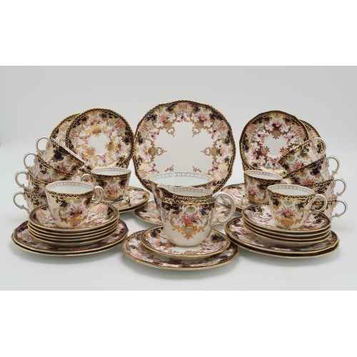 2162 - A ROYAL CROWN DERBY TEASETin 3788 Imari pattern, comprising twelve tea cups, saucers, plates, cake p... 