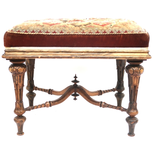 2015 - A 19TH CENTURY WALNUT FRAMED STOOL with tapestry upholstered seat on extensively carved turned suppo... 