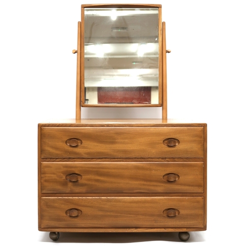 2107 - A MID 20TH CENTURY ERCOL ELM AND BEECH DRESSING CHEST with adjustable dressing mirror over three lon... 