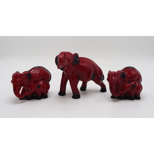 2151 - A ROYAL DOULTON FLAMBE MODEL OF AN ELEPHANT13cm high, together with two smaller groups of elephant a... 