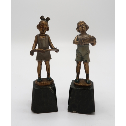 2158 - J.H. LAND - A pair of gilt bronze and enamel Art Deco figures, modelled as boy with accordion and gi... 