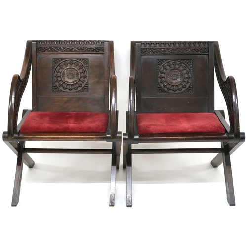 2006 - A PAIR OF VICTORIAN OAK GLASTONBURY CHAIRS backs carved with ecclesiastical motifs over central cres... 