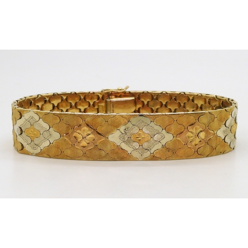 2710 - A THREE COLOUR GOLD BRACELETItalian made, stamped 750, with engraved flower pattern to the interlock... 