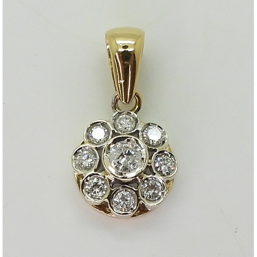 2731 - A DIAMOND FLOWER PENDANTmounted in 18ct gold and set with estimated approx 0.60cts of brilliant cut ... 