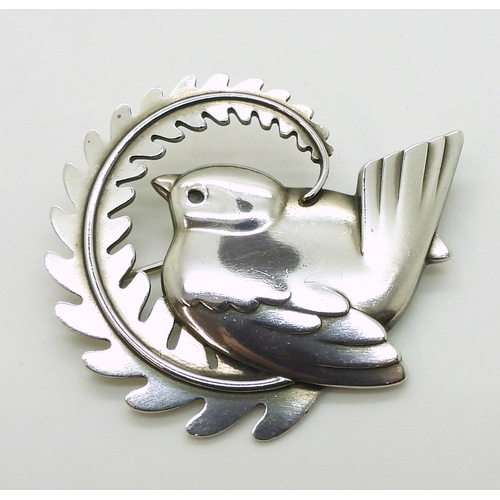 2734 - A GEORG JENSEN BROOCHnumber 309, designed by Arno Malinowski bird with a fern. Fully stamped with Ge... 