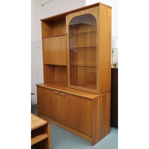 96 - A 20th century teak veneered wall unit with fall front compartment alongside glazed door on two door... 