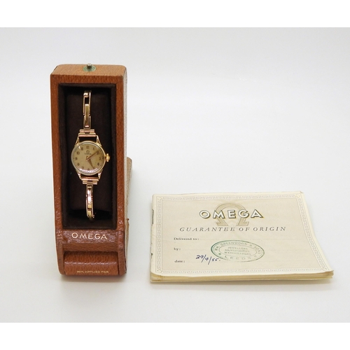 2914 - A LADIES OMEGA WRISTWATCHboth the case and the strap are in 9ct gold, inscribed and dated 1955, Birm... 