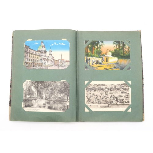 455 - An album of early-20th century postcards, to include views of New York, Ohio, Rome, Calcutta, variou... 