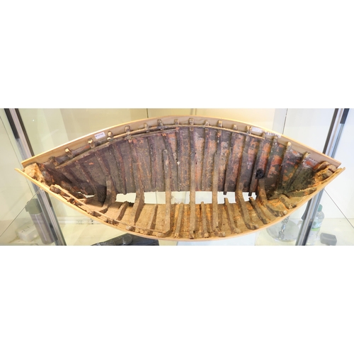 462 - A well-weathered strip-planked miniature boat, measuring approx. 75cm in length