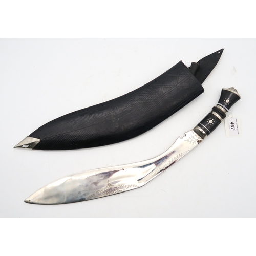 467 - An ornamental kukri, with lion mask pommel, the 37cm-long blade punch-engraved 