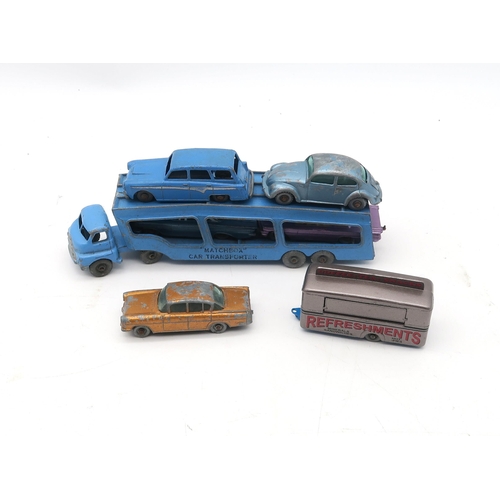 472 - A collection of loose Matchbox model vehicles of mixed age, to include a Car Transporter, Mobile Can... 