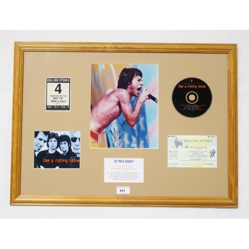 491 - The Rolling Stones/Sir Mick Jagger: a memorabilia display featuring a colour photograph of Jagger si... 