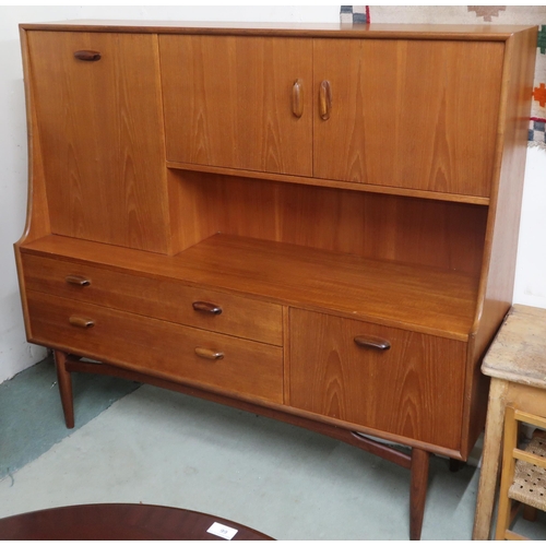 104 - A mid 20th century teak G Plan Fresco sideboard/drinks cabinet with pair of doors alongside fall fro... 