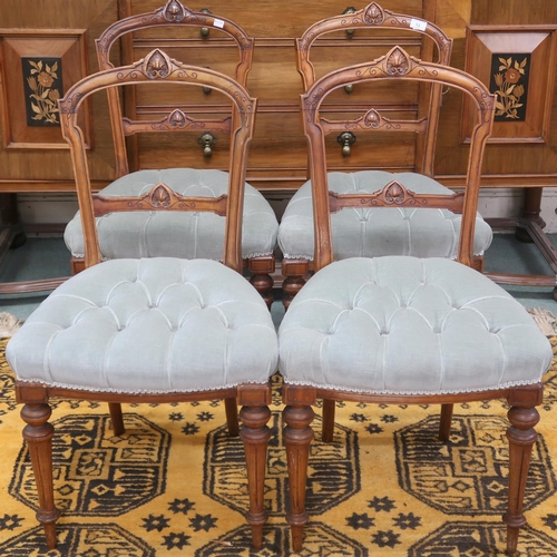 13 - A set of four Victorian Walnut framed parlour chairs with carved back rests over button upholstered ... 