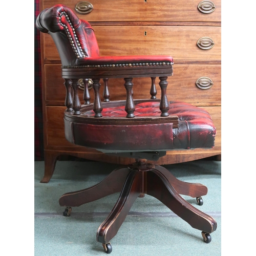 15 - A 20th century oxblood leather button back upholstered captains style swivel desk chair, 80cm high x... 