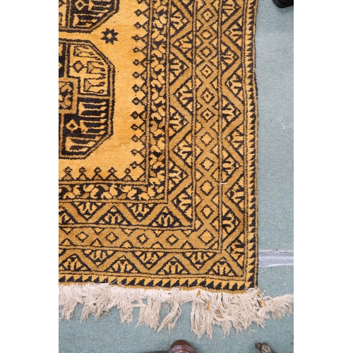 23 - A yellow ground Bokhara rug with lozenge pattern ground and geometric border, 314cm long x 216cm wid... 