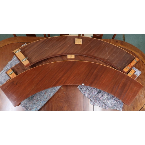 33 - A 20th century mahogany extending dining table and eight chairs, dining table with circular top with... 