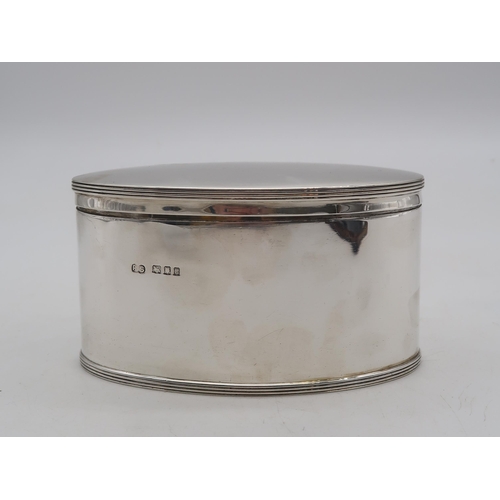 353 - A George V silver biscuit box, by Robert Stewart, London 1918, of oval form, 424gms