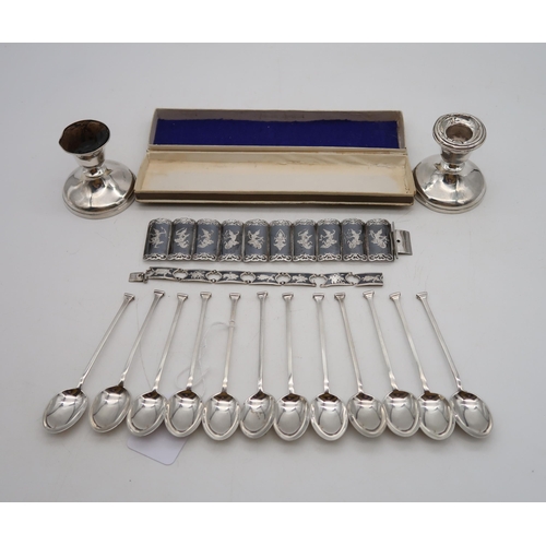 360 - A collection of silver including two Thai white metal bracelets, a set of silver seal top spoons, Co... 