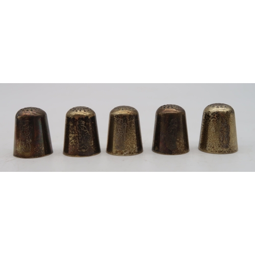 363 - A collection of silver and white metal thimbles, including novelty examples modelled as a bowler hat... 