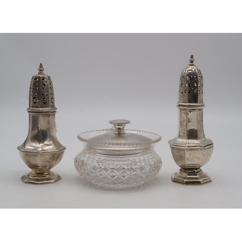 367 - A silver caster, London, of faceted form, another similar, Chester, a silver cut glass vanity jar, b... 