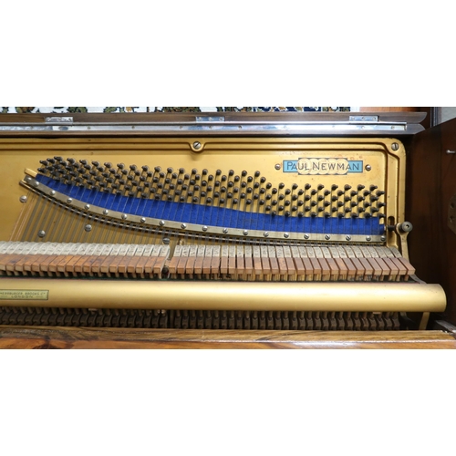 37 - A 20th century walnut veneered Paul Newman upright overstrung piano, 114cm high x 134cm wide x 56cm ... 