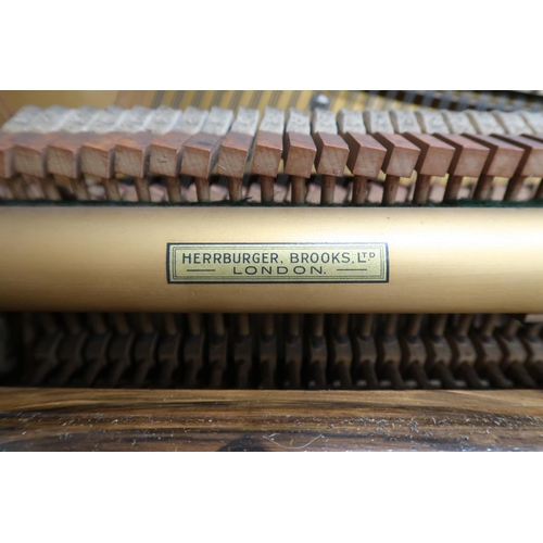 37 - A 20th century walnut veneered Paul Newman upright overstrung piano, 114cm high x 134cm wide x 56cm ... 