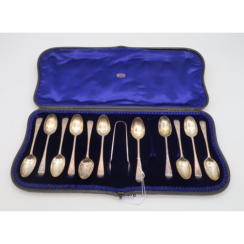 370 - A cased set of silver tea spoons and sugar tongs, London, in the Old English pattern, bright-engrave... 