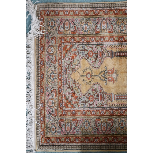 4 - A yellow ground Turkish silk prayer rug with multicoloured flowerhead border, 138cm long x 91cm wide