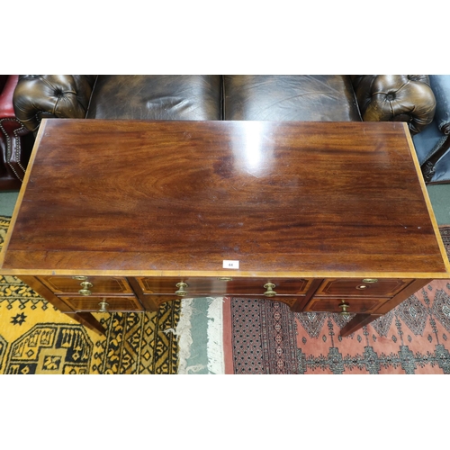 44 - A Victorian mahogany desk with long central drawer flanked by two short drawers either side on squar... 