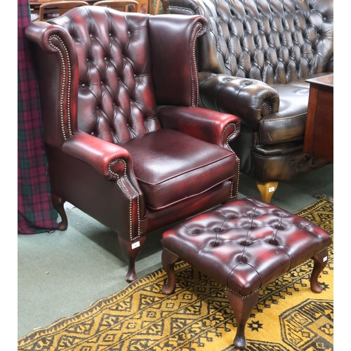 45 - A 20th century oxblood leather button back upholstered Chesterfield style wingback armchair, 106cm h... 
