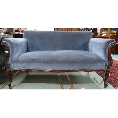 47 - A Victorian blue velour upholstered sofa on carved cabriole supports terminating in ceramic casters,... 