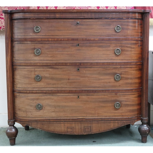52 - A 19th century mahogany chest with four long drawers flanked by reeded columns on turned supports jo... 
