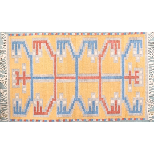 56 - A yellow ground Kilim tribal rug with blue and red geometric patterned ground, 154cm long x 96cm wid... 