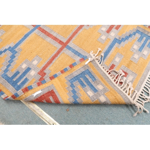 56 - A yellow ground Kilim tribal rug with blue and red geometric patterned ground, 154cm long x 96cm wid... 