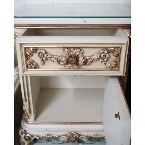 58 - A pair of 20th century Louis XVI style painted bedside cabinets with single drawer over cabinet door... 