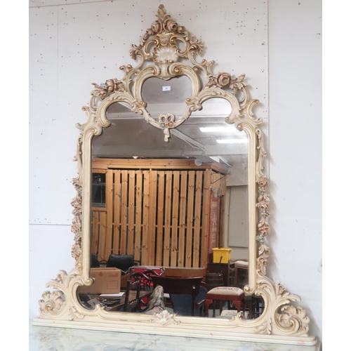 60 - A 20th century cream and gilt rococo style framed overmantle mirror, 152cm high x 135cm wide