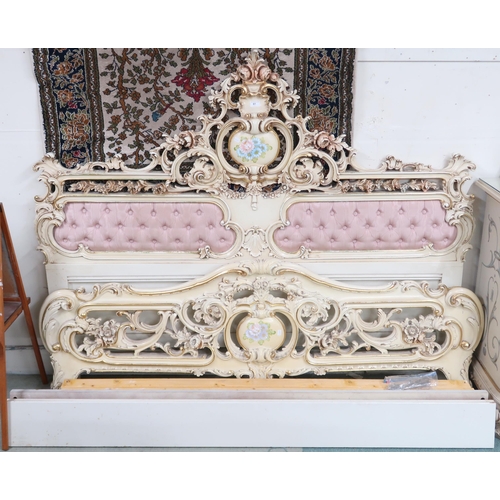 61 - A 20th century Louis XVI style cream and gilt painted super king sized bedframe with button upholste... 