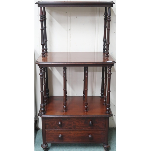 7 - A Victorian mahogany what-not with two open shelves separated buy turned supports over two drawers o... 