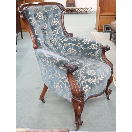 72 - A Victorian walnut framed floral upholstered parlour armchair on cabriole supports, 95cm high x 61cm... 