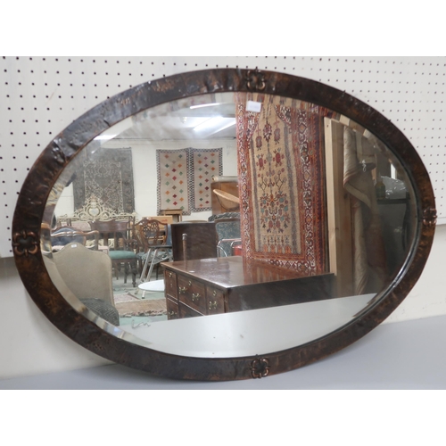 80 - A lot comprising early 20th century oval hammered copper bevelled glass wall mirror, 58cm high x 84c... 