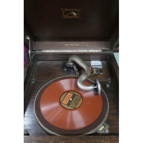 97 - An early 20th century oak cased His Masters Voice hand cranked gramophone, 92cm high x 46cm wide x 5... 