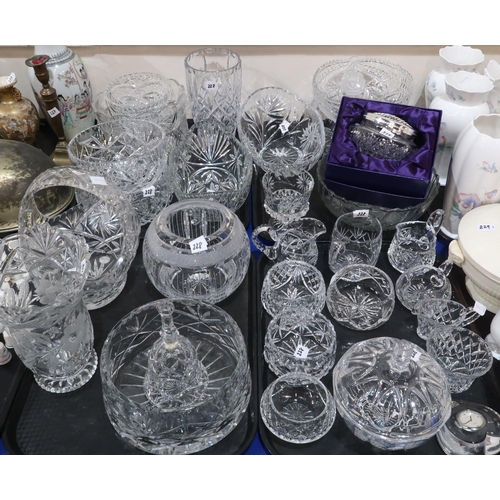 228 - A quantity of cut glass and crystal including milk jug and sugar bowl sets, bowls, vases etc