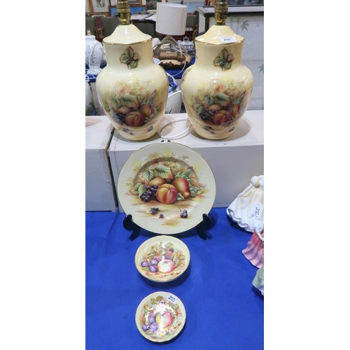 255 - A pair of Aynsley Orchard Gold table lamps, together with a plate and two dishes